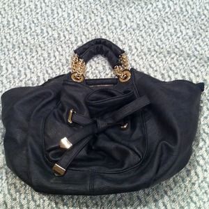 Gray/dark blue purse. Gold trim