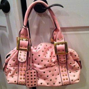 Pale pink purse with gold studs and trim