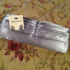 Brand new silver clutch hand bag