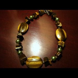 Heavy stone necklace.