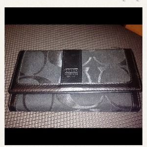 Black wallet coach labeled