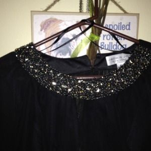 One pair of Calvin Klein jeans an a black top