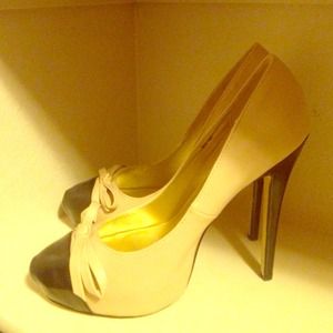 Brand new never worn beige pumps with black toes
