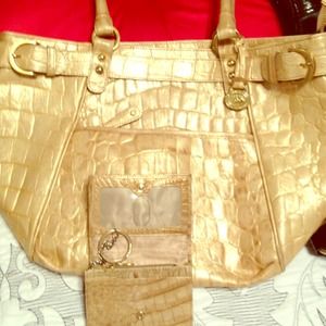 Brahmin leather handbag and key chain.