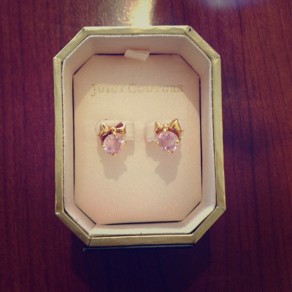 Gold Juicy Couture earrings with pink stone.