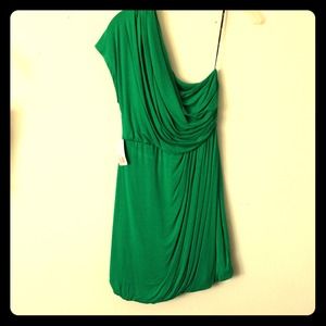 Green one shoulder dress.