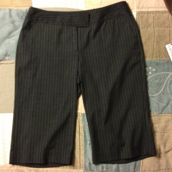 Black pinstripe office attire shorts. Knee length.