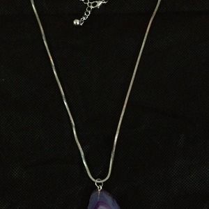 Sterling silver chain with pendent.