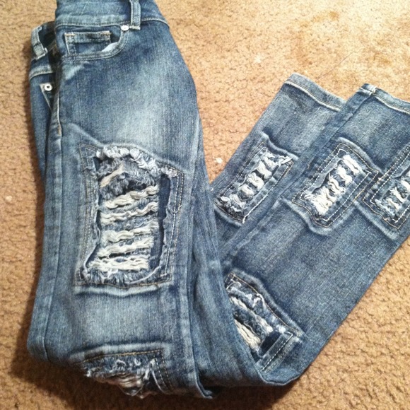 Distressed playboy jeans