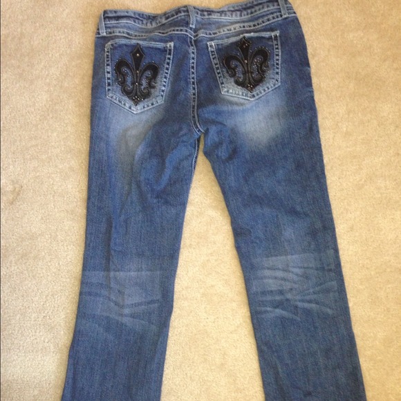 Women's boot cut jeans with fluer de lis pockets