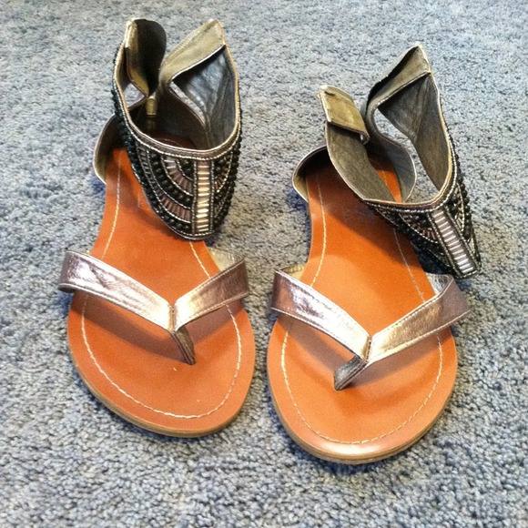 Silver beaded gladiator sandals.