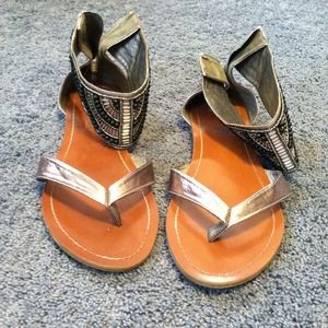 Silver beaded gladiator sandals.