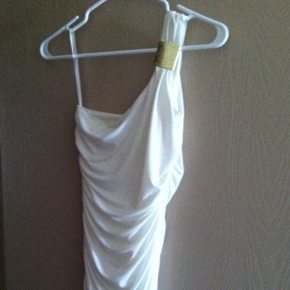 Cream fitted dress with gold accent.