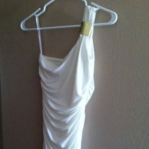 Cream fitted dress with gold accent.