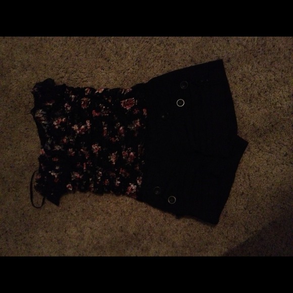 Black shorts and floral shirt