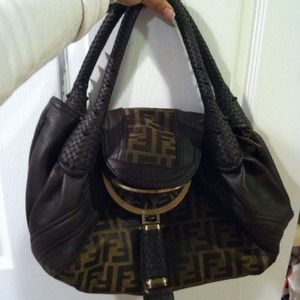 Brown leather bag with monogram f fabric