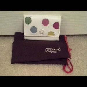 Authentic coach ID holder