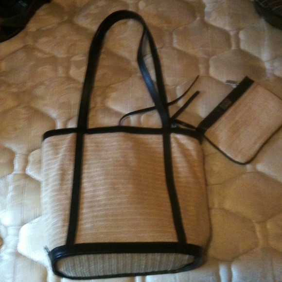 Straw shoulder bag with black trim and coin purse.
