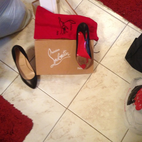 Christian Louboutin classic black pumps.