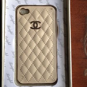 Tan Chanel case with gold emblem