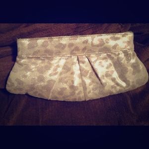 Animal print gold tone clutch. Very cute purse.