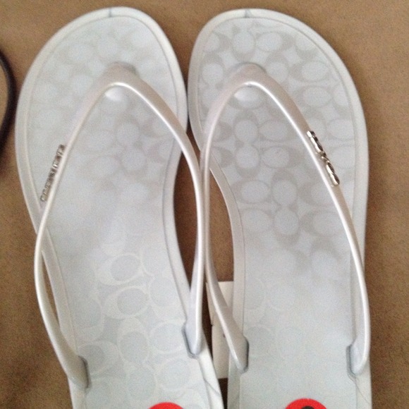 SOLD!! Brand new Coach flip flops