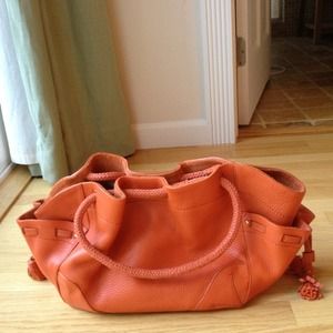 Colehaan village pebble leather purse orange