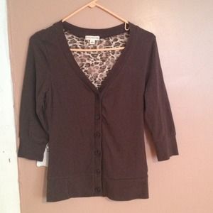 Brown button up quarter sleeve shirt.