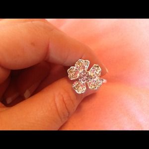 Silver flower with pink/purple rhinestones