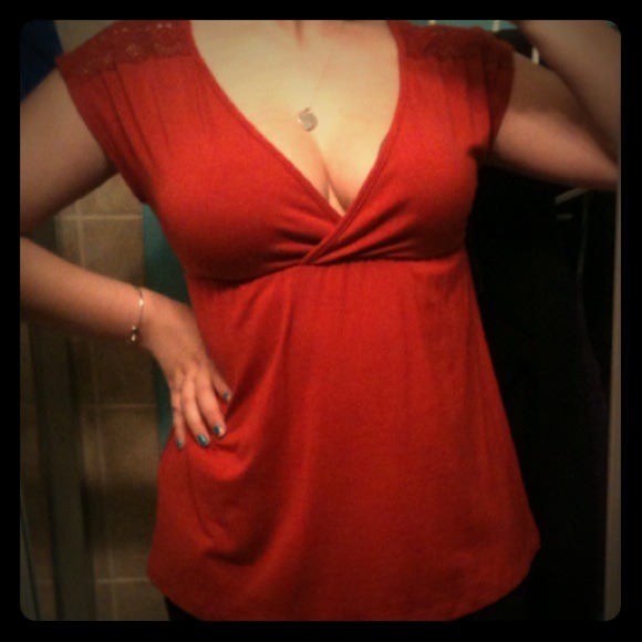 Charlotte Russe orangey top with lace on shoulders