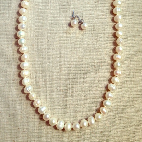 Pearl necklace and earrings.