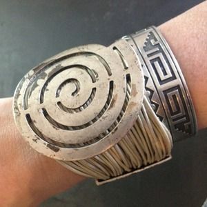 Swirl metal and leather cuff