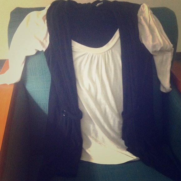 White sleeve shirt with black vest built in.