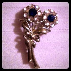 Silver Rose pin w/ blue & white rhinestones