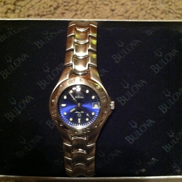 Silver Bulova watch with blue face