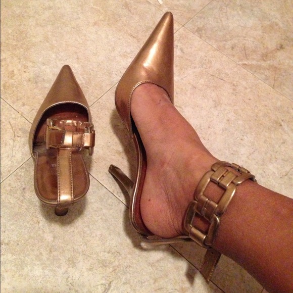 Gold pointy heels