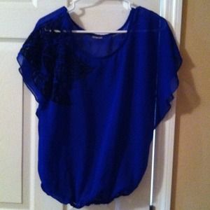 Blue shirt with black flower