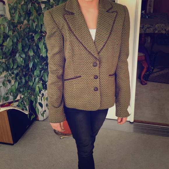 Woven green jacket with brown trim and buttons