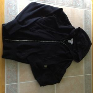 Black zip up sweat shirt.