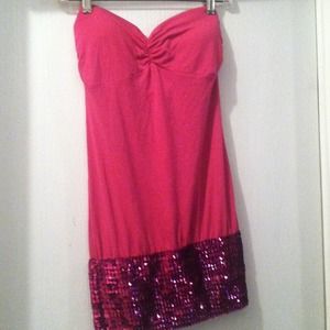 A formal pink strapless dress.