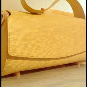Just reduced EPI cream Louis Vuitton hang bag.