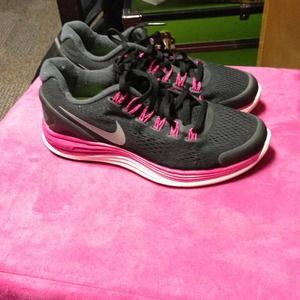 Pink and black Nike lunar glide running shoes.