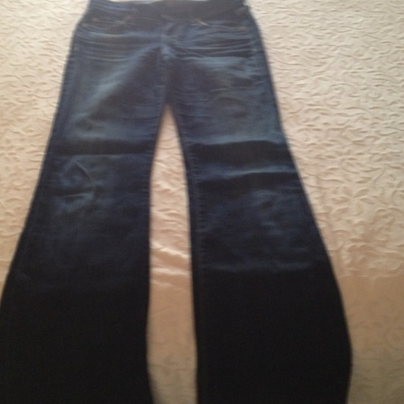 7 dark washed jeans.  Full leg with flare.