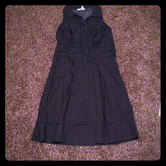 Sleeveless black dress with white polka dots!