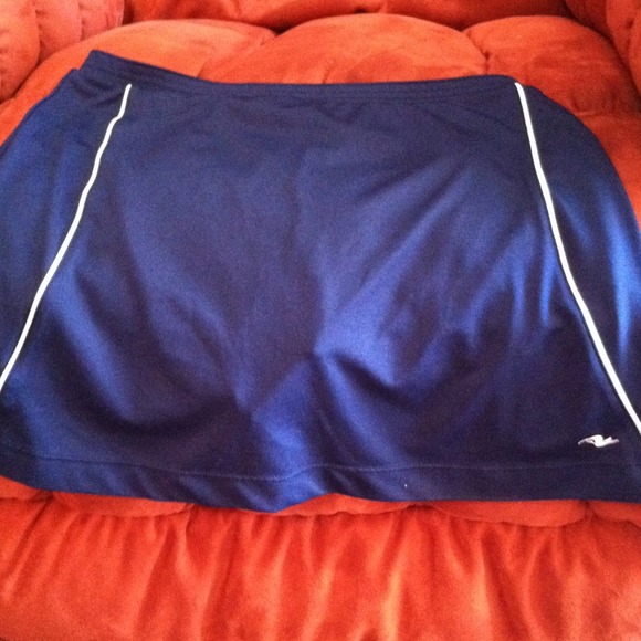 Tennis shirt with shorts underneath