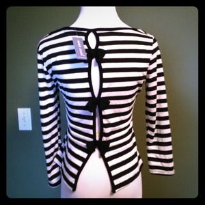 Brand new with bows in the back half sleeved shirt