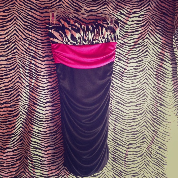 Short black dress with zebra and pink detailing.