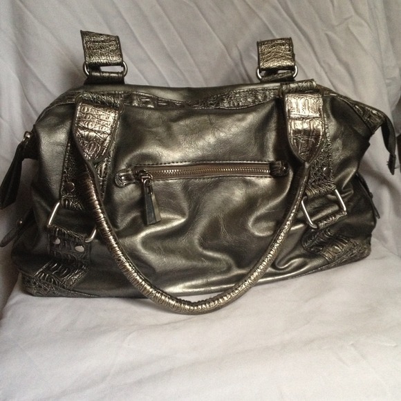 Silver purse with purple lining inside