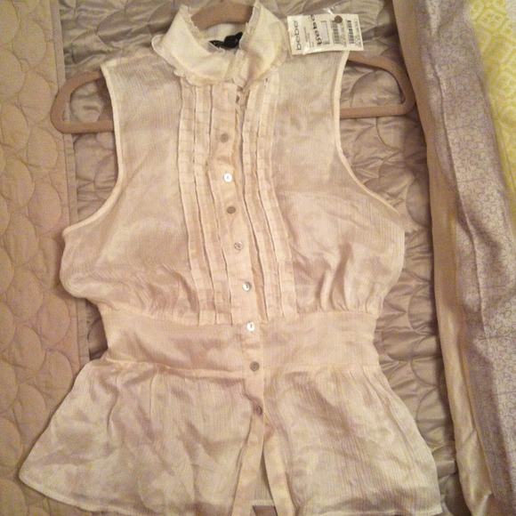 Silk cream colored BEBE ruffle blouse