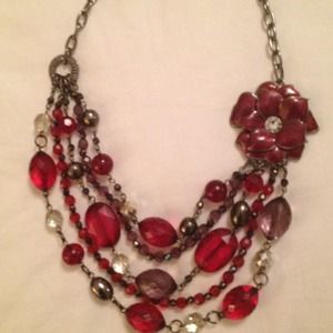 Silver and red necklace with flower detail